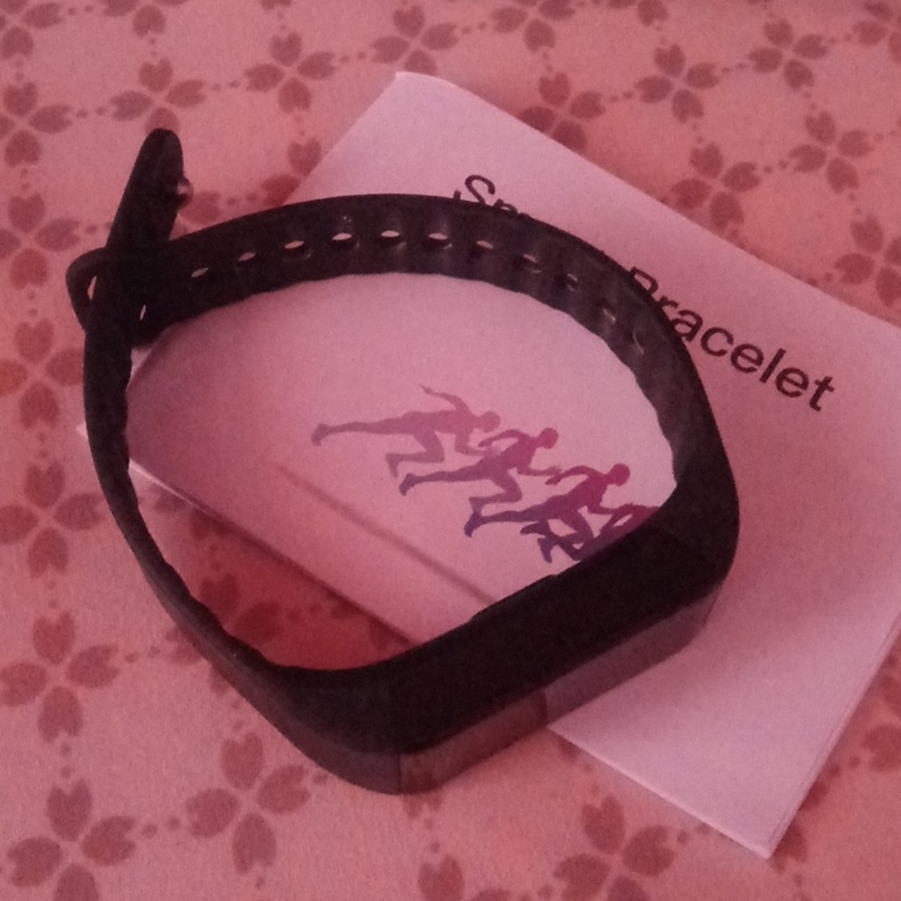 Black smart bracelet and manual